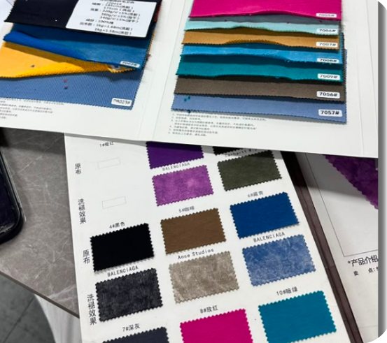 Fabric swatch books spread on a table