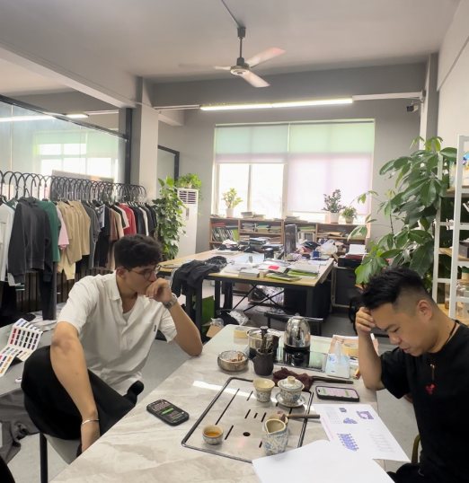 Working through sample details at the studio table
