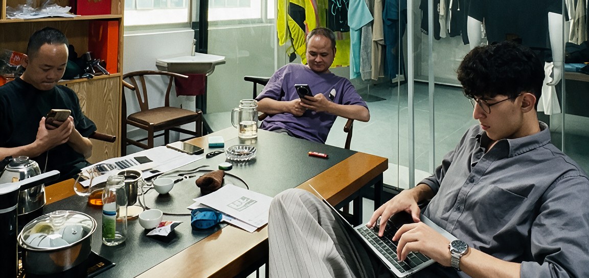 Reviewing garments and quotes at the desk